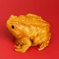 Detailed macro view of an amber translucent toad squishy stress relief toy with texture - Gold Toad