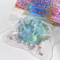 Close-up of soft glitter cat paw squishy toy with pearls in transparent packaging bag - Green Crystal Cat Paw / Green