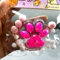 Close-up of a pink cat paw squishy stress relief toy with cute decorative pom-poms - Rose Red Crystal Cat Paw / Rose Red