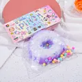Dettaglio di una ciambella squishy glitterata viola in una simpatica confezione - Ciambella Viola