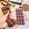 Soft chocolate bar squishy toy shown being squeezed for stress relief detail - Large Chocolate Bar / Black