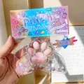 Detail view of a cute pink cat paw squishy stress relief toy in colorful packaging - Clear Pink Cat Paw