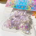 Detail of purple glitter cat paw squeeze toy decorated with pearls and butterfly - Purple Crystal Cat Paw / Purple
