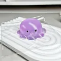 Macro view of a purple octopus maltose squishy toy with a translucent Q-elastic texture. - Purple