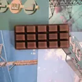 Detailed macro view of chocolate-bar-shaped slow rebound squishy toy for stress relief - Printed Chocolate / 1 Piece / Dark Brown