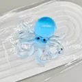 Blue translucent octopus squeeze toy featuring internal colorful glitter and decorative beads - Blue Sequin