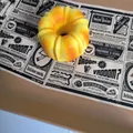 Detailed macro view of a yellow bundt cake shaped slow-rebound PU squishy toy. - Donut Style