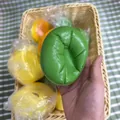 Green slow-rising simulation bread squishy toy held in hand showing slow rebound effect - Matcha Cake