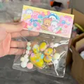 Yellow floral cat paw squishy toy for stress relief in sweet family packaging. - Clear Yellow Cat Paw