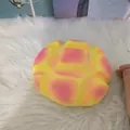 Detailed close-up of a pink and yellow pineapple bun slow rebound squishy toy on white fur - Large Pineapple Bun / Pink