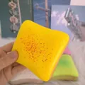 Close-up of slow rising cheese toast squishy toy with colorful sprinkles for stress relief. - Cheese Toast