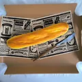 Close-up detail of a realistic slow rebound PU baguette squishy toy on vintage prop paper - Baguette Style