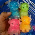Close-up of colorful translucent glitter bison squishy toys for stress relief - Highland Cow / 8x6cm / Maltose Pink