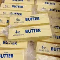 Realistic 4oz butter-shaped squishy squeeze toy in vintage plastic wrap packaging - Classic Butter Stick / Classic Yellow (14cm)