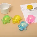 Close-up of colorful maltose turtle squishies with sparkly sequins for stress relief. - Turtle Shape