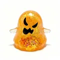 Close-up view of a translucent orange glittery Halloween ghost squishy decompression toy - Medium / Yellow Ghost