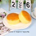 Two realistic slow rebound cheese bun stress relief toys on a white plate - Large / Burger Bun (SZ00069)