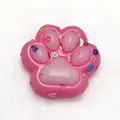 Pink cat paw squishy toy for stress relief with colorful glitter decorative accents - Colored Pink