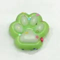 Cute light green cat paw squishy toy with colorful star and heart sequins. - Colored Green