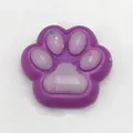 Purple cat paw squishy stress relief toy featuring translucent lavender gel pads and stars - Colored Purple