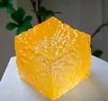Yellow translucent cube stress relief squishy toy featuring a unique cratered texture - Honeycomb Wave Ice Cube [Orange] OPP Bag