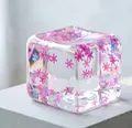 Clear square ice cube squishy toy featuring pink snowflake sequins embedded inside - Snowflake Ice Cube [Pink] OPP Bag