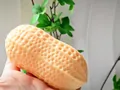 Peanut-shaped sensory squeeze toy in peach color for stress relief and fidgeting - Realistic Peanut Squishy / Beige