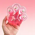 Detailed view of large pink transparent cat paw squishy toy with strawberry inserts inside - 230g Size / 15cm Pink Jumbo Strawberry Cat Paw