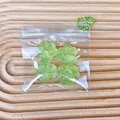 Four mini green cat paw squishy stress relief toys in transparent bag with chain - Set of 4 / Green