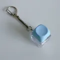 Close-up of a light blue mechanical switch fidget keychain on a white background - Without Light Snake Chain / Blue