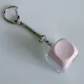 Detail view of a mechanical switch fidget keychain with a pink keycap on white background - Without Light Snake Chain / Pink