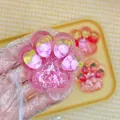Jouet anti-stress adorable en forme de patte de chat rose translucide à la fraise - Style Raisin (7cm)