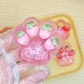 Mignon jouet anti-stress squishy patte de chat fraise rose avec garniture pailletée - Style Fraise Visqueuse (7cm)