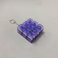Detailed macro view of purple transparent 9-key mechanical switch fidget toy keychain. - Transparent Purple
