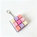 Close-up of a vibrant 9-key mechanical keyboard fidget toy keychain in pastel colors - Model 00921 / With LED Lights