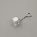 Detailed view of a high-transparency white mechanical keyboard keycap keychain - 1 Key