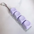 Fidget mechanical keyboard switch tester keychain featuring 4 purple macaron keycaps - Purple