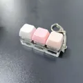 Detailed close-up of a 3-key mechanical keyboard switch fidget keychain in pink and white. - 3-Key Linear Style (6260846758366) / Non-Luminous - Blister Card / Macaron Pink White Gradient