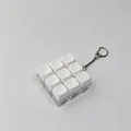 Detailed macro view of a 9-key white mechanical keyboard switch fidget keychain - 9 Key Style