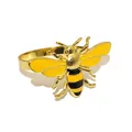 Close-up detail of a charming yellow and black enamel bee napkin ring with golden metal band - Little Bee 1