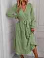 Detail view of a sage green V-neck tiered maxi dress with long sleeves and a waist tie - S / Green