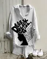 Gros plan d'une chemise en lin blanc avec un imprimé graphique noir audacieux - S / Hauts / Impression de Lettres (NSCS-009)