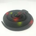 Realistic rubber toy snake with black scales and red-yellow accents for prank parties. - 140cm King Cobra / Black Leopard Print