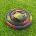 Realistic red and green coiled simulation toy snake prank prop displayed on green artificial grass - 70cm Cobra / Black