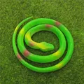 Realistic green toy snake with soft rubber texture on a lush green grass background - 70cm Grass Snake / Green