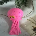 Rosa Quallen-förmiges Antistress-Spielzeug zum Quetschen mit niedlichen gelben Augen - Oktopus / Rosa