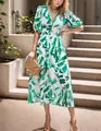 Detail view of the elegant V-neck maxi dress with artistic green brush-stroke print. - Light Green (Artistic Print)