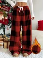 Detail view of red and black buffalo plaid fleece pants with a warm thickened lining. - S / Bottoms / Red and Black Grid