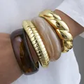 Chunky acrylic and gold-tone metal bangle bracelet set with marbled and ribbed textures - Personality Round Bangle Set (6755101) / Four-Piece Set / Gold Amber Milk White Combo