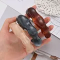 Set of chunky irregular acrylic open bracelets in three marble and amber stylish colors - Wavy Open Style (6764401HB) / Apricot Grey Amber Combo